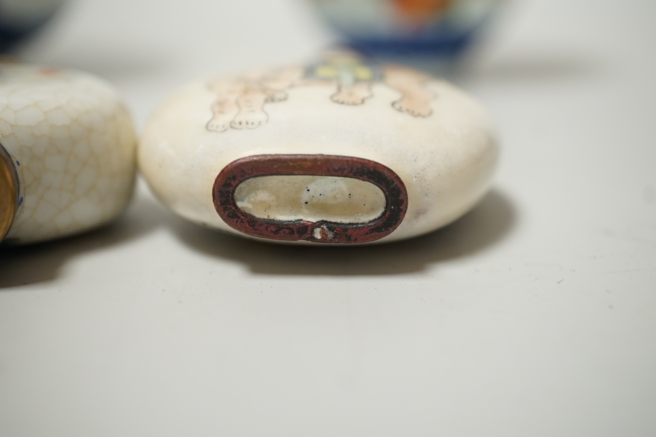 A 19th century Chinese blue and white bowl, an enamelled goldfish cup and two snuff bottles